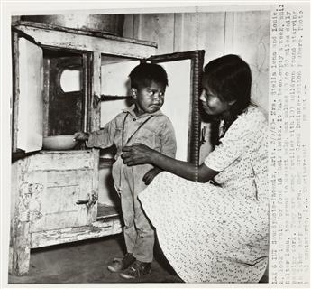 (FARM LABOR) A group of 15 photographs depicting a migrant farm workers camp in Arizona where children were reported starving.